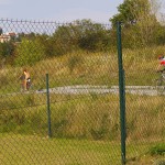Playing beach volleyball and riding a bike