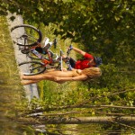 Playing beach volleyball and riding a bike