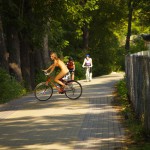 Playing beach volleyball and riding a bike