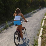 Playing beach volleyball and riding a bike