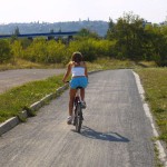 Playing beach volleyball and riding a bike