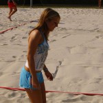 Playing beach volleyball and riding a bike