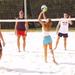 Playing beach volleyball and riding a bike