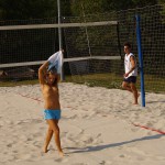 Playing beach volleyball and riding a bike