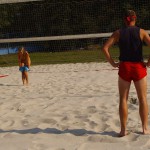 Playing beach volleyball and riding a bike