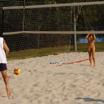 Playing beach volleyball and riding a bike