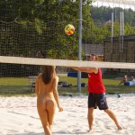 Playing beach volleyball and riding a bike