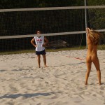 Playing beach volleyball and riding a bike