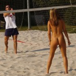 Playing beach volleyball and riding a bike