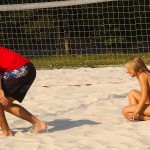 Playing beach volleyball and riding a bike