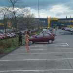 At the parking lot of a shopping