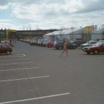 At the parking lot of a shopping