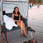 In a bicycle riksha in the city center