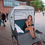 In a bicycle riksha in the city center