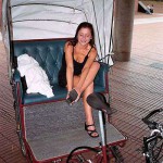 In a bicycle riksha in the city center