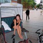 In a bicycle riksha in the city center