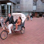 In a bicycle riksha in the city center