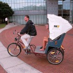 In a bicycle riksha in the city center