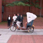 In a bicycle riksha in the city center