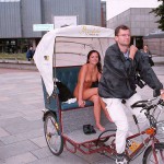 In a bicycle riksha in the city center