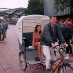 In a bicycle riksha in the city center