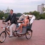 In a bicycle riksha in the city center