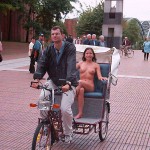 In a bicycle riksha in the city center