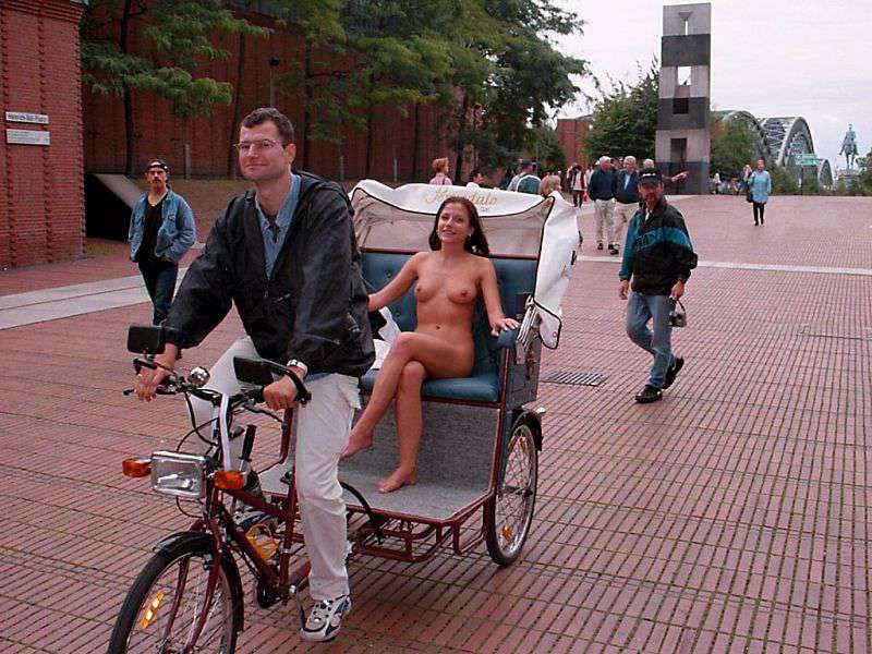 In a bicycle riksha in the city center