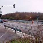 At a traffic light and zebra crossing