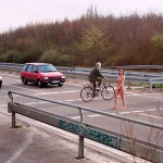 At a traffic light and zebra crossing