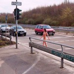 At a traffic light and zebra crossing