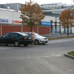 On a parking lot and in the center