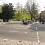 At a crossing in front of a palace