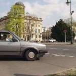 At a crossing in front of a palace