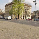 At a crossing in front of a palace