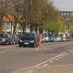 At a crossing in front of a palace