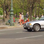 At a crossing in front of a palace