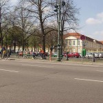 At a crossing in front of a palace