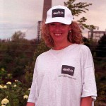 On a pedestrian bridge and in a park