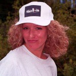 On a pedestrian bridge and in a park