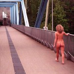 On a pedestrian bridge and in a park