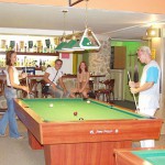 At a small billiard bar