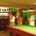 At a small billiard bar