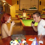 At a small billiard bar