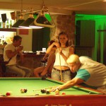 At a small billiard bar