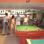 At a small billiard bar