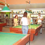 At a small billiard bar