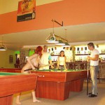 At a small billiard bar