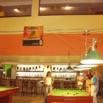 At a small billiard bar