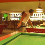 At a small billiard bar